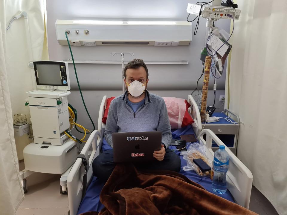 In this photo provided by Matt Swider, posted on Twitter on March 9, 2020, Matt Swider lies on a hospital bed with his laptop, while in quarantine in the north coast city of Marsa Matrouh, Egypt. Swider, an American tourist, has been confined there since he tested positive for the new coronavirus after a Nile cruise in southern Egypt. For most people, the new coronavirus causes only mild or moderate symptoms. For some it can cause more severe illness. (Matt Swider via AP)