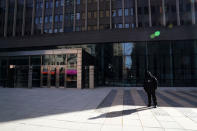 A security guard stands outside a closed federal building in the Manhattan borough of New York City, New York, U.S., January 15, 2019. REUTERS/Carlo Allegri