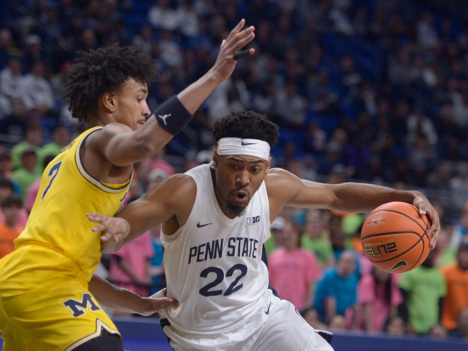 Penn State's Jalen Pickett drives to the basket on Michigan's Kobe Bufkin.