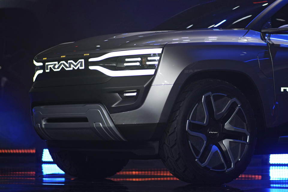 The Ram 1500 Revolution electric battery powered pickup truck is displayed on stage during the Stellantis keynote at the CES tech show Thursday, Jan. 5, 2023, in Las Vegas. (AP Photo/John Locher)