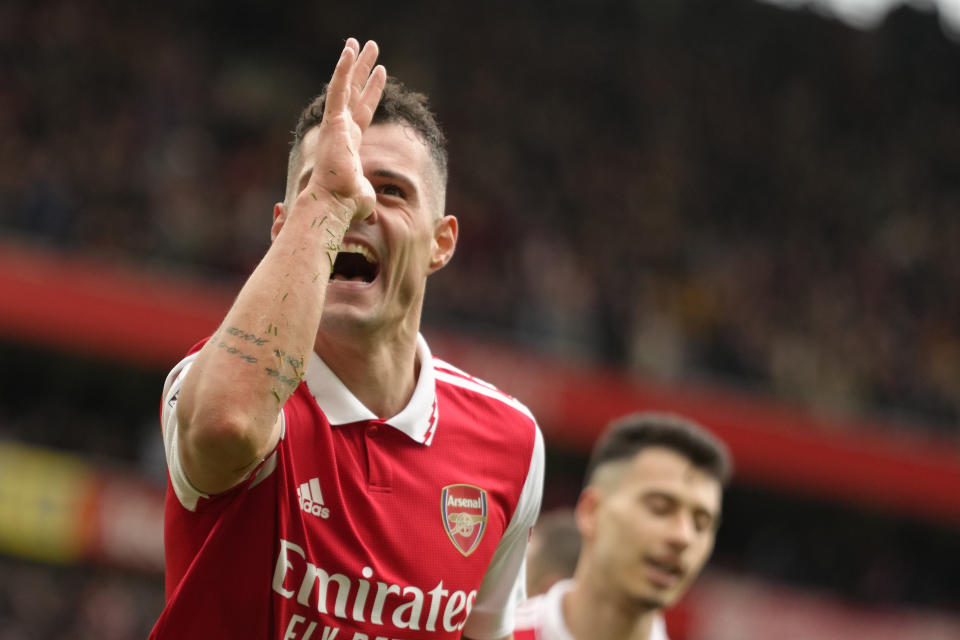 Arsenal's Granit Xhaka celebrates after scoring his side's third goal during the English Premier League soccer match between Arsenal and Crystal Palace at Emirates stadium in London, Sunday, March 19, 2023. (AP Photo/Kirsty Wigglesworth)