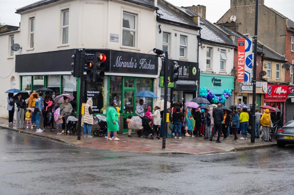 People queued in the rain to see Melanin Magic open its doors in July (Tabz Wilson/PA)