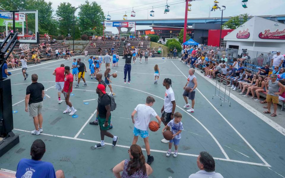The Gruber Law Offices SportsZone at Summerfest is alive with activity prior to the 2nd Alumni Charity Challenge on Friday. Teams representing UW-Madison, UW-Milwaukee, UW-Green Bay and Marquette participated.