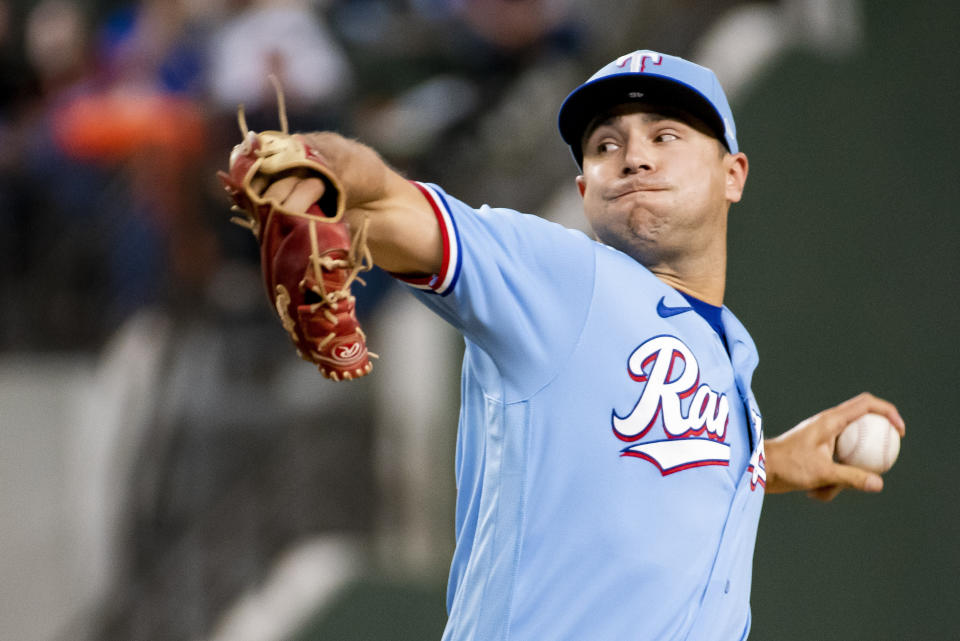 Texas Rangers relief pitcher Brock Burke delivers in the top of the seventh inning in a baseball game against the Philadelphia Phillies in Arlington, Texas, Sunday, April 2, 2023. (AP Photo/Emil T. Lippe)