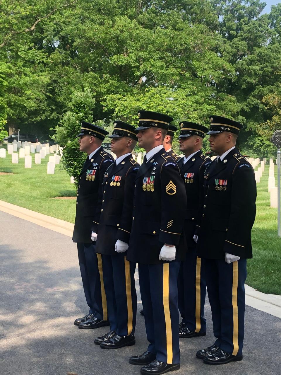 Members of the U.S. Army's Honor Guard stand in attention on May 20 at Arlington National Cemetery.