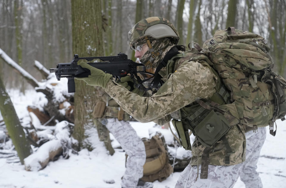 A member of Ukraine's Territorial Defense Forces, volunteer military units of the Armed Forces, trains in a city park in Kyiv, Ukraine, Saturday, Jan. 22, 2022. Dozens of civilians have been joining Ukraine's army reserves in recent weeks amid fears about Russian invasion. (AP Photo/Efrem Lukatsky)