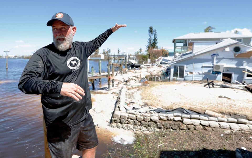 John Lynch, owner of the Blue Dog Grill in Matlacha and a local resident, describes how the storm caused his neighborÕs home to sink several feet Sunday October 02, 2022.