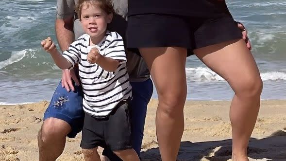 princess eugenie and family posing on a beach