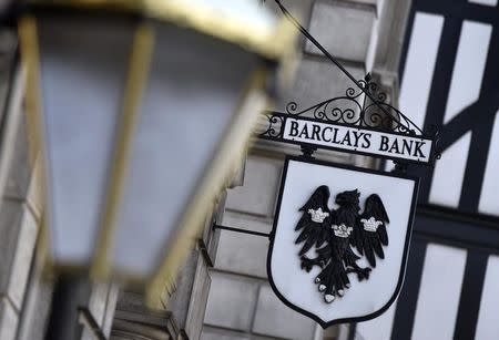 A Barclays sign hangs outside a branch of the bank in the City of London July 30, 2014. REUTERS/Toby Melville