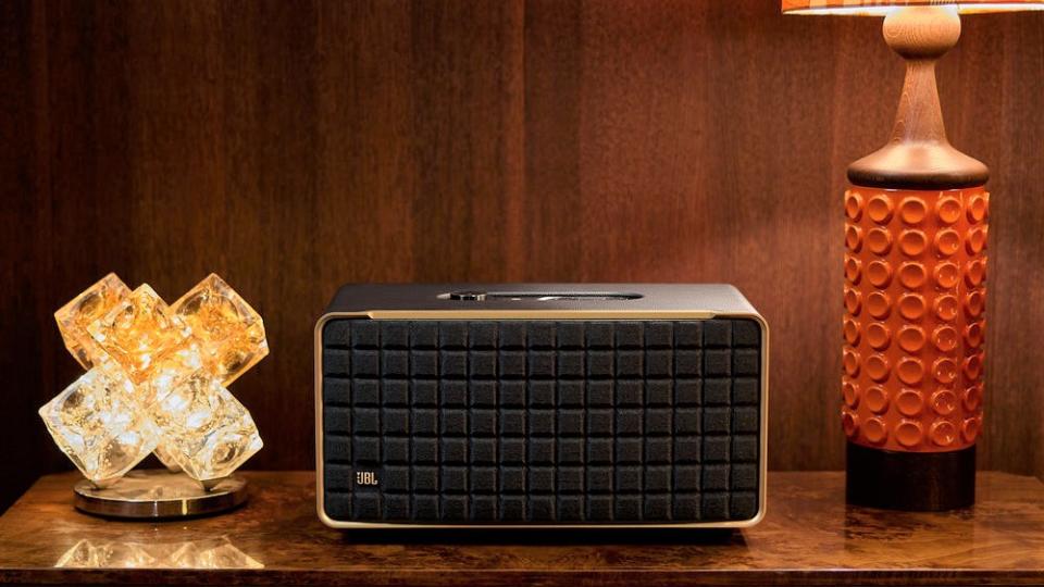 PR lifestyle shot of JBL Authentics 500 smart speaker placed on a sideboard