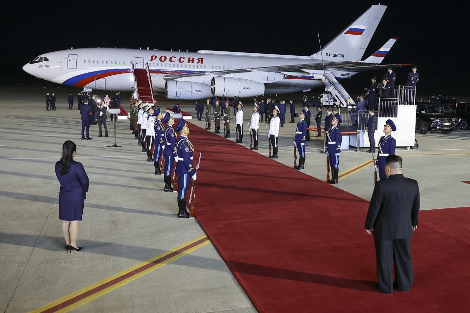 North Korea's leader Kim Jong Un, back to a camera, stands waiting to meet Russian President Vladimir Putin at the Pyongyang Sunan International Airport outside Pyongyang, North Korea, on Tuesday, June 18, 2024. (Vladimir Smirnov, Sputnik, Kremlin Pool Photo via AP)