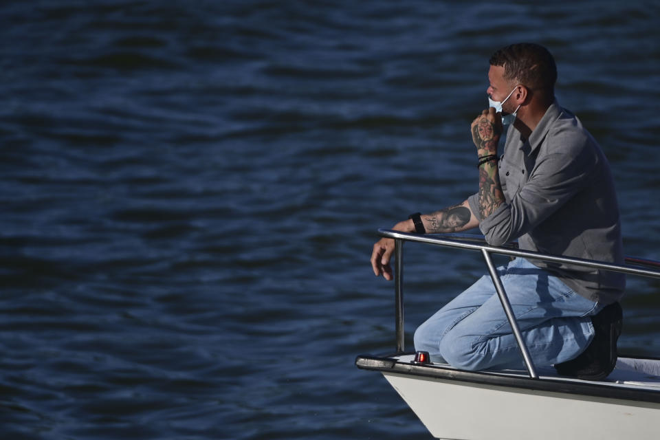 Jose Antonio Rodriguez, the father of 27-year-old Keishla Rodriguez, leaves the San Jose Lagoon after authorities found her remains there in San Juan, Puerto Rico, Saturday, May 1, 2021. A federal judge on Monday ordered Puerto Rican boxer Félix Verdejo held without bail after he was charged in the death of Rodriguez, his pregnant lover whose body was found in the lagoon. (AP Photo/Carlos Giusti)