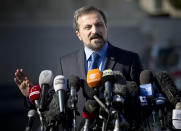 Louay Safi, spokesperson for the Syrian National Coalition, Syria's main political opposition group, gestures as he talks to journalists after a meeting with the Syrian government at the United Nations headquarters in Geneva, Switzerland, Switzerland, Tuesday, Feb 11, 2014. A second round of peace talks between the Syrian government and the opposition bogged down quickly Tuesday in recriminations about who was responsible for escalating violence that has killed hundreds in the past few days and disrupted food aid for trapped civilians. (AP Photo/Anja Niedringhaus)