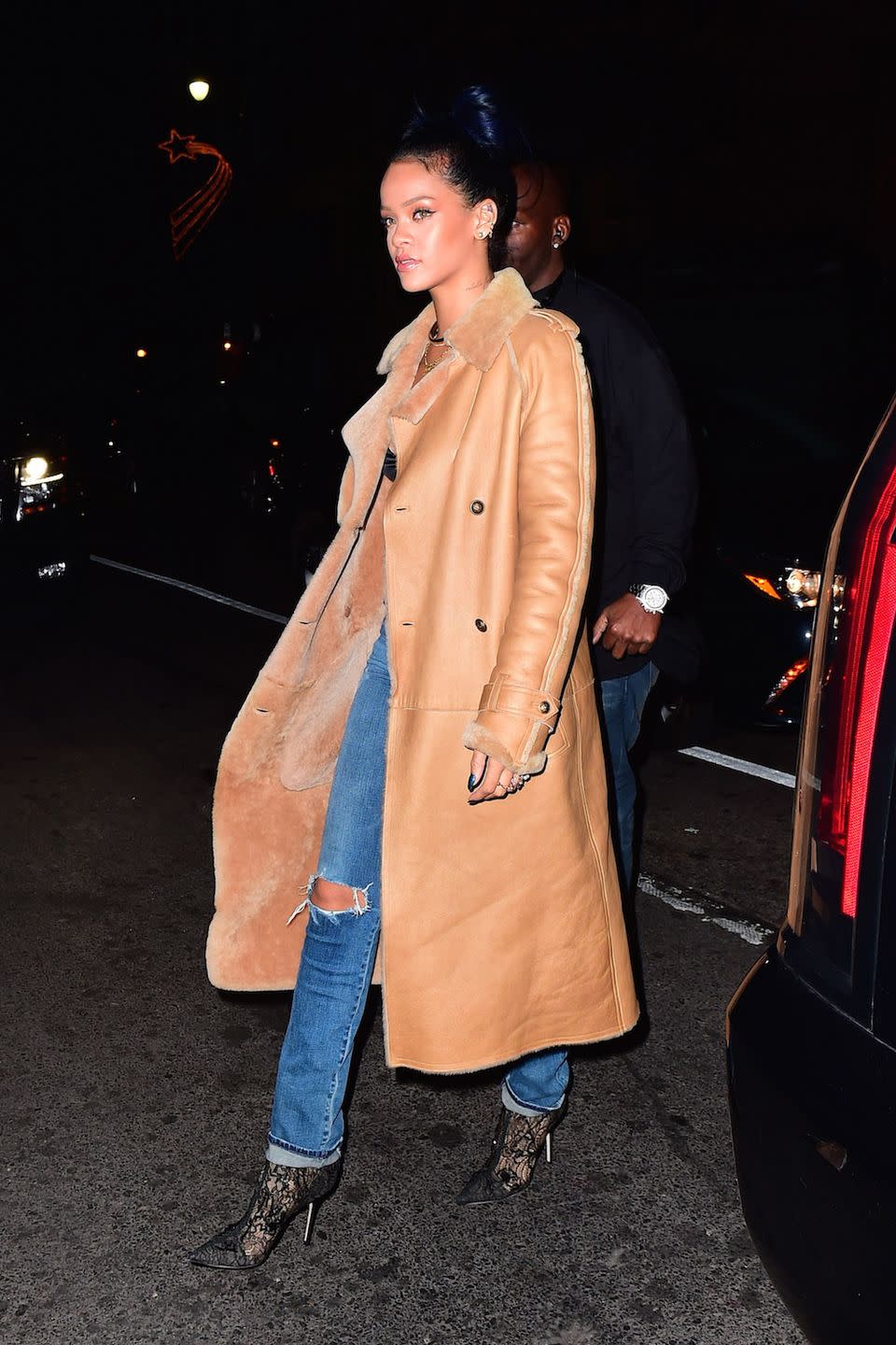 <p>Sporting shearling and denim with lace-patterned booties for a night out in New York</p>