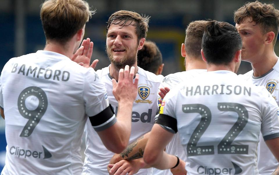 Liam Cooper celebrates with his Leeds team-mates - GETTY IMAGES