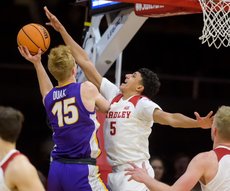 Bradley's Christian Davis (5) tries to block a shot by Northern Iowa's Michael Duax in the second half of their Missouri Valley Conference basketball opener Wednesday, Nov. 30, 2022 at Carver Arena. The Braves defeated the Panthers 68-53.