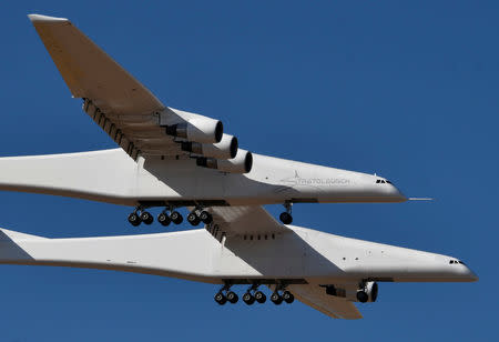 The world's largest airplane, built by the late Paul Allen's company Stratolaunch Systems, makes its first test flight in Mojave, California, U.S. April 13, 2019. REUTERS/Gene Blevins