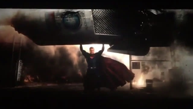 <strong>UPDATE:</strong> <em>One day after the Batman v. Superman trailer leaked online, Zack Snyder tweeted the official two-minute teaser trailer. You can watch the official trailer below. </em> It's only been a few days since director Zack Snyder revealed that the <em>Batman v. Superman </em>trailer would debut in select IMAX theaters on April 20, and after it was leaked on the Internet (and removed), the director has officially released the highly-anticipated footage. One question we had when first viewing the trailer was: Where's Batman?! #BatmanvSuperman #NotBlurry #NotPirated https://t.co/6twr1oFBvr— ZackSnyder (@ZackSnyder) April 17, 2015 <strong>PHOTOS: 7 Sexiest Superman Stars</strong> The two-minute trailer is everything you'd expect from a Christopher Nolan-produced film. While it is heavy on the scenes with Henry Cavill's Superman, there are a few glimpses of Ben Affleck's Batman. After all, his name does come first in the movie title. The trailer picks up where <em>Man of Steel </em>left off and shows that Superman is having some trouble with his public persona. While neither caped-crusader speaks until the end, most of the trailer includes news pundits commenting over images of Superman, and questioning his motives. One pundit points out, "Is it really surprising that the most powerful man in the world should be a figure in controversy?" Warner Bros. "We as a population on this planet have been looking for a savior," another man is heard saying. "Maybe he's just a guy trying to do the right thing," someone else says. Warner Bros. Opposing that opinion, the next pundit voice says, "Human beings have a terrible track record of following people with great power." <strong> NEWS: Ben Affleck to His 'Batman' Critics -- I Can Do This </strong> A woman chimes in, "The world has been so caught up with what he can do that no one has asked what he should do." Cameras then zoom into a statue where someone has spray painted "False God." It's not until a minute into the trailer that Affleck pops up looking ready to don the Dark Knight suit. Warner Bros. He's next seen suited up and standing on tall buildings, only to later confront Superman at the very end of the trailer. Warner Bros. <em> Batman v. Superman: Dawn of Justice</em> hits theaters on March 25, 2016, and you can watch the official trailer in theaters on Monday, April 20. <em>On this Flashback Friday, check out Michael Keaton's Batman, below.</em>