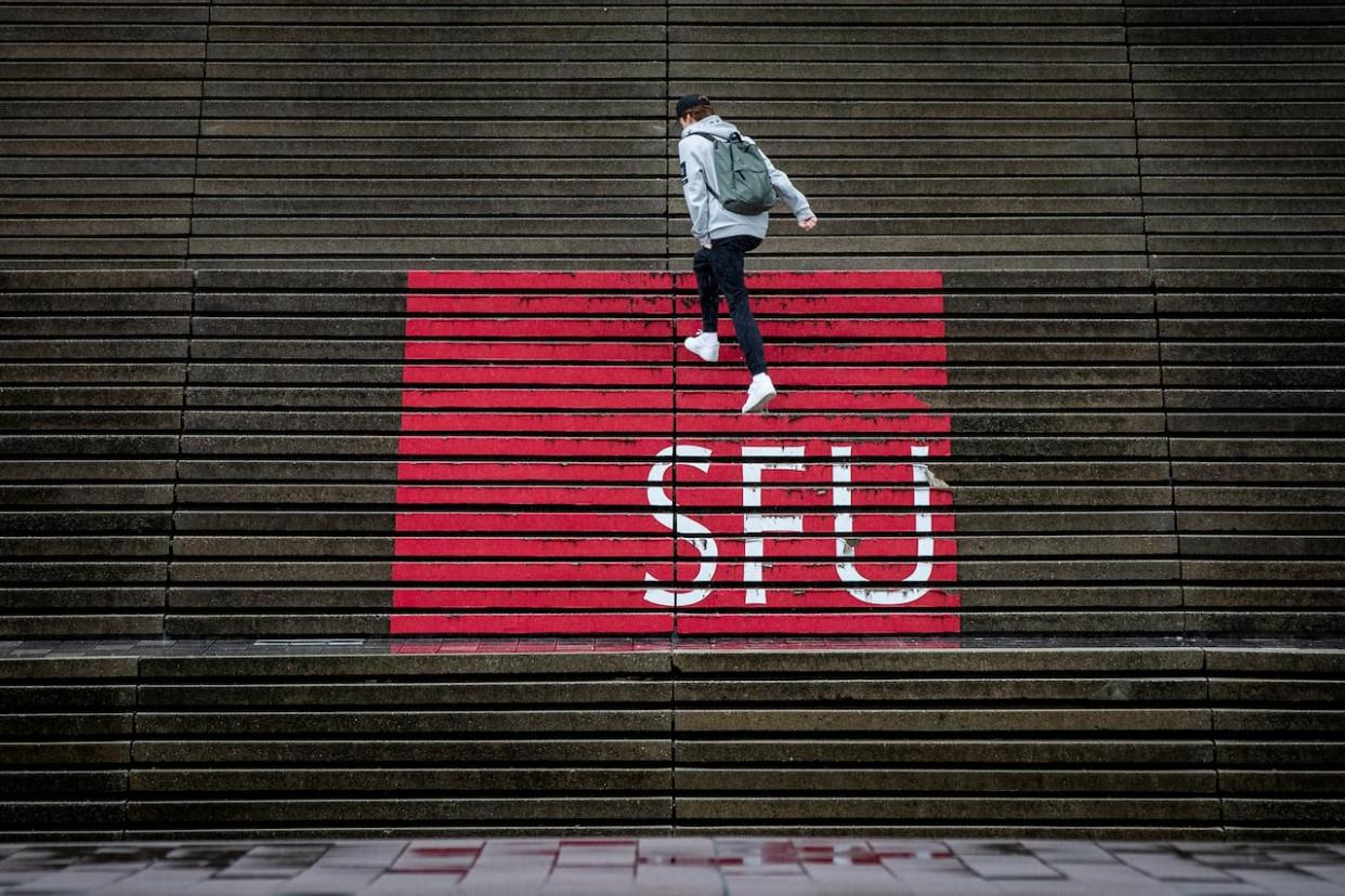 The cuts follow SFU president Joy Johnson's sudden and controversial decision last year to eliminate the school's football team. (Ben Nelms/CBC - image credit)