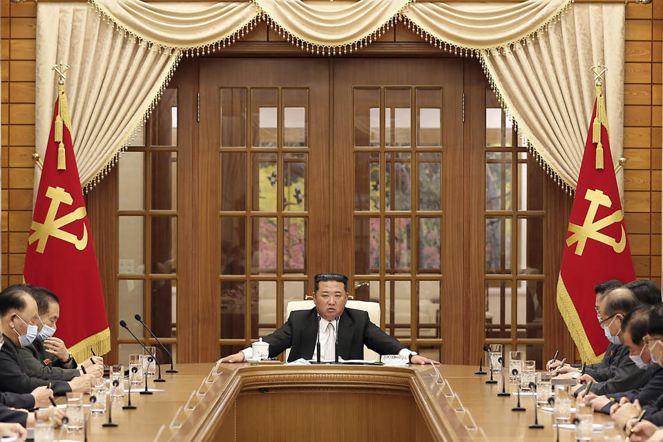 In this photo provided by the North Korean government, North Korean leader Kim Jong Un, center, attends a meeting of the Central Committee of the ruling Workers' Party in Pyongyang, North Korea Thursday, May 12, 2022. Independent journalists were not given access to cover the event depicted in this image distributed by the North Korean government. The content of this image is as provided and cannot be independently verified. (Korean Central News Agency/Korea News Service via AP)