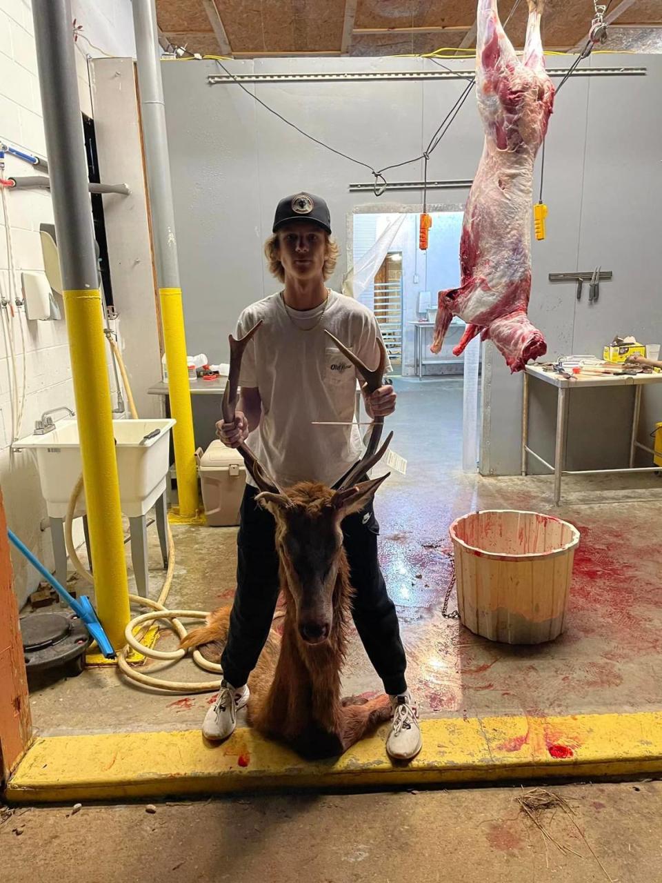 At the Whaley Tannery & Taxidermy in Wedowee, Alabama, Coye Potts, 16, of Roanoke, shows the head of the red stag deer he killed with one shot from a crossbow November 3, 2022, on the Rock Mills property owned by his maternal grandfather, Phillip Taylor.