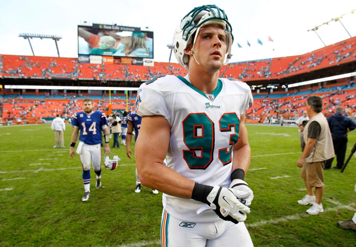 Miami Dolphins linebacker Jason Trusnik (93) walks off the field after an NFL football game against the Buffalo Bills, Sunday, Nov. 20, 2011, in Miami Gardens, Fla. (AP Photo/ Lynne Sladky)