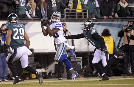 Dallas Cowboys wide receiver Dez Bryant (88) catches a pass for a touchdown as Philadelphia Eagles strong safety Nate Allen (29) and cornerback Bradley Fletcher (24) defend in the fourth quarter at Lincoln Financial Field. Dec 14, 2014; Philadelphia, PA, USA; Eric Hartline-USA TODAY Sports