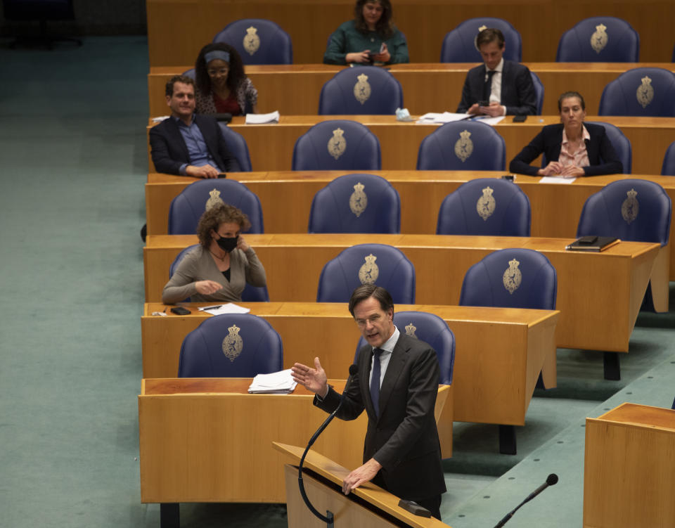 Caretaker Dutch Prime Minister Mark Rutte dresses parliament after surviving a no-confidence motion in parliament in The Hague, Netherlands, early Friday, April 2, 2021. Rutte was fighting for his political life in a bitter parliamentary debate about the country's derailed process of forming a new ruling coalition following elections last month. (AP Photo/Peter Dejong)