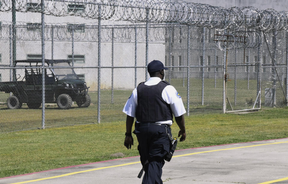 Prison staff work at Lee Correctional Institution on Wednesday, April 10, 2019, in Bishopville, S.C. A year after seven South Carolina prison inmates died in an insurrection, corrections officials say they've made improvements to the facility that for a night was the scene of some of the agency's worst violence. (AP Photo/Meg Kinnard)