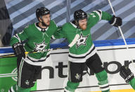 Dallas Stars' Joe Pavelski (16) celebrates his goal against the Vegas Golden Knights with Jamie Oleksiak (2) during the second period of Game 4 of the NHL hockey Western Conference final, Saturday, Sept. 12, 2020, in Edmonton, Alberta. (Jason Franson/The Canadian Press via AP)