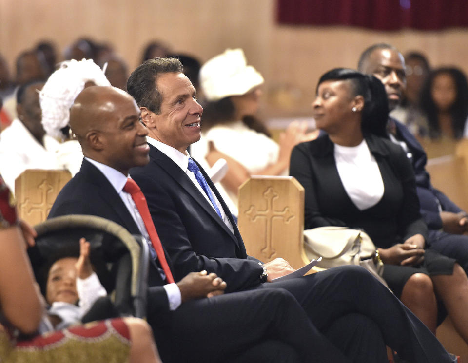 In this photo provided by the Office of the Governor of New York, New York Gov. Andrew Cuomo, center left, sits with the congregation at the First Baptist Church of Crown Heights in the Brooklyn borough of New York, Sunday, Aug. 19, 2018. In a searing speech from the pulpit, Cuomo said Donald Trump has fooled many people in this country, but the Democrat said the Republican president hasn't fooled New Yorkers. Cuomo hammered the president for creating what he called a "frightening portrait" of today's America. (Office of the Governor of New York/Kevin Coughlin via AP)