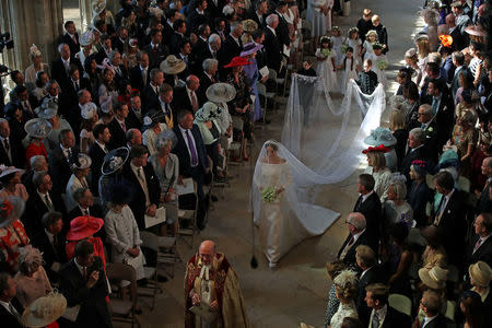 Meghan Markle walks down the aisle as she arrives in St George's Chapel at Windsor Castle for her wedding to Prince Harry in Windsor, Britain, May 19, 2018. Danny Lawson/Pool via REUTERS