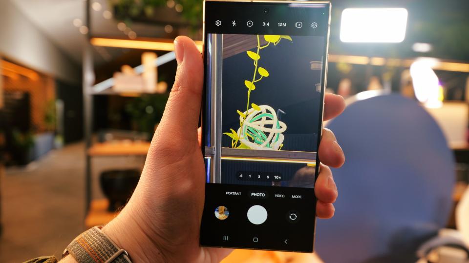 Samsung Galaxy S24 Ultra phone showing the camera app held in a hand