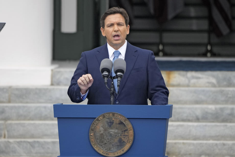 FILE - Florida Gov. Ron DeSantis speaks to the crowd after being sworn in to begin his second term during an inauguration ceremony outside the Old Capitol on Jan. 3, 2023, in Tallahassee, Fla. Florida lawmakers will move to increase state control of Walt Disney World's private government, according to a notice published Friday, Jan. 6, 2023, that marks the latest development in a feud over a law critics call “Don't Say Gay.” DeSantis last year signed legislation that would dissolve the Disney government in June 2023. (AP Photo/Lynne Sladky, File)