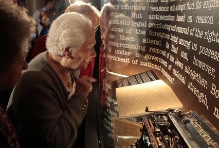 Holocaust survivors Renee Firestone, 87 (C) and Elizabeth Mann, 85 (R) view a copy of the 'Gemlich Letter', which was written by Adolf Hitler in 1919 and unveiled for public display at the Museum of Tolerance in Los Angeles, California October 4, 2011. REUTERS/Lucy Nicholson