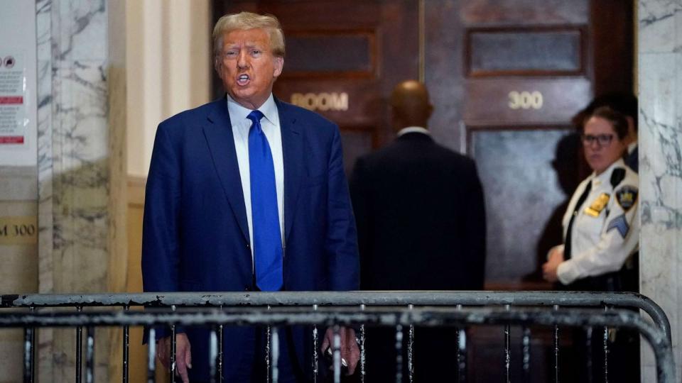 PHOTO: Former President Donald Trump speaks to the media as he arrives for his civil fraud trial at New York State Supreme Court, Oct. 25, 2023, in New York City. (Timothy A. Clary/AFP via Getty Images)