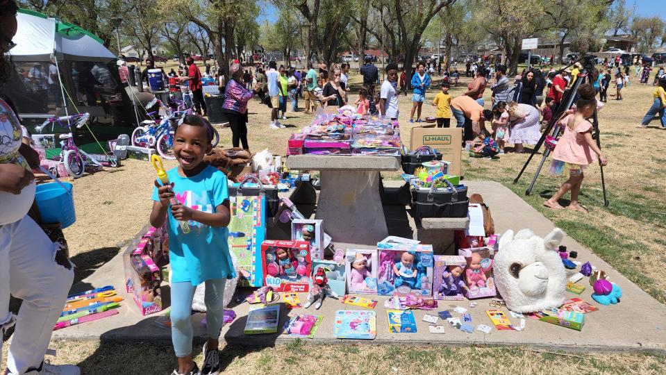A young girl walks away after claiming her prize at Bones Hooks Park during the 2022 Shi Lee's Easter Egg Hunt.