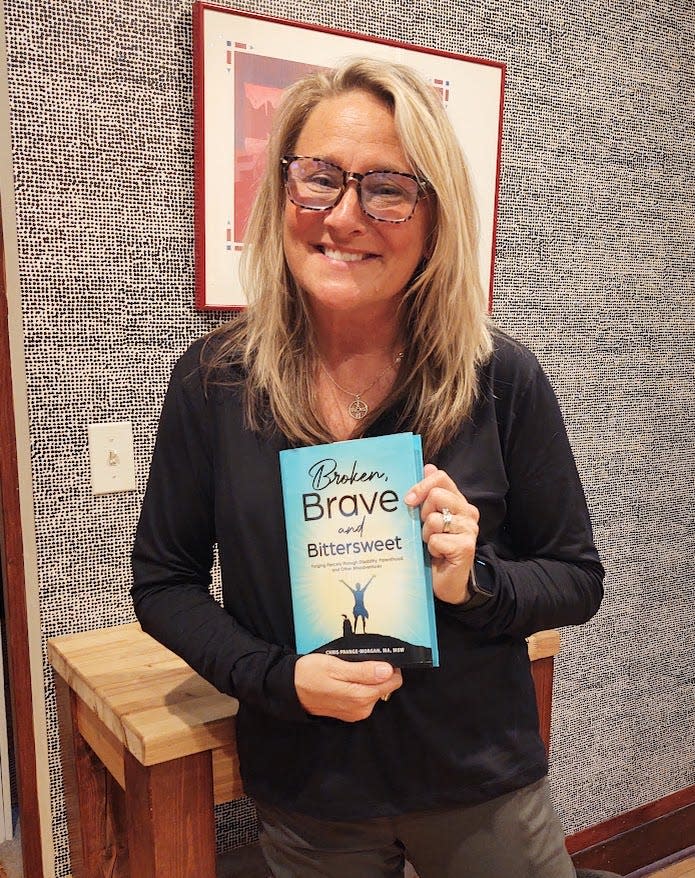 Chris Prange-Morgan poses with her book "Broken, Brave and Bittersweet: Forging Fiercely Through Disability, Parenthood, and Other Misadventures."