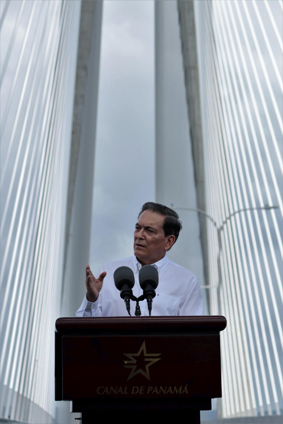 Panama's President Laurentino Cortizo speaks during the opening of the new bridge that spans the Panama Canal, in Colon, Panama, Friday, August 2, 2019. The 4.6 km bridge spans the canal but on the Caribbean side of the country. (AP Photo/Eric Batista)