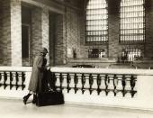 A woman with a suitcase stands at the top level of Grand Central Station in New York City in this undated handout photo. It made its debut in the heyday of cross-country train travel, faced demolition in the era of the auto, and got a new lease on life with a facelift in its eighth decade. Now Grand Central Terminal, the doyenne of American train stations, is celebrating its 100th birthday. Opened on Feb. 2, 1913, when trains were a luxurious means of traveling across America, the iconic New York landmark with its Beaux-Arts facade is an architectural gem, and still one of America's greatest transportation hubs. (REUTERS/Bettmann Archive/Corbis)