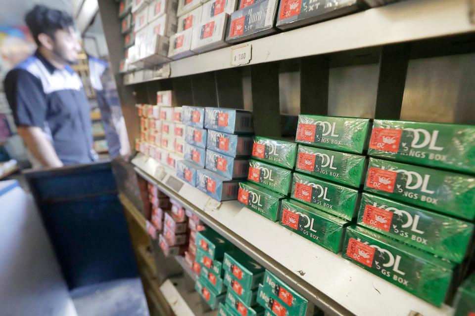 FILE - This May 17, 2018 file photo shows packs of menthol cigarettes and other tobacco products at a store in San Francisco. On Thursday, April 29, 2021, the Food and Drug Administration pledged again to try to ban menthol cigarettes, this time under pressure from African American groups to remove the mint flavor popular among Black smokers. (AP Photo/Jeff Chiu, File) ORG XMIT: NY573