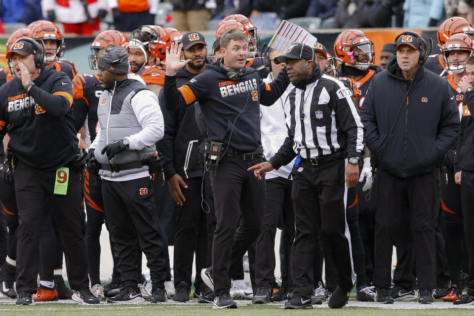 Cincinnati Bengals head coach Zac Taylor, center, reacts to a play call resulting in a New England Patriots fumble recovery off wide receiver Alex Erickson in the first half of an NFL football game, Sunday, Dec. 15, 2019, in Cincinnati. (AP Photo/Gary Landers)