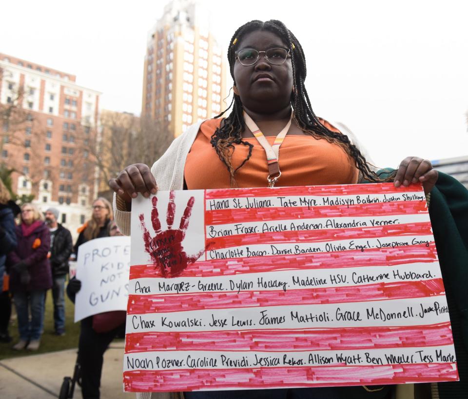 Michigan State University student Asha Denny wields signage, Thursday, March 23, 2023, during the March for Our Lives rally at the state Capitol. The event was organized by the MSU chapter, in wake of the recent campus shooting rampage that killed three and critically injured five.