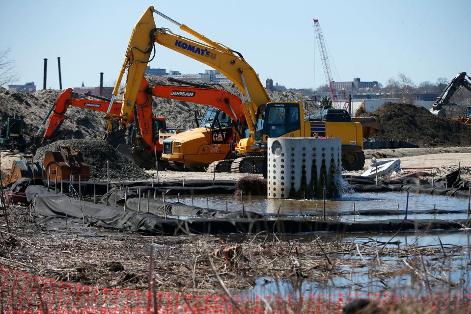 Excavators are hard at work next to a groundwater reservoir during Phase 1 of the two-phase project re-introducing a brook surrounded by marshland.  The Buzzards Bay Coalition is re introducing marshland onto Marsh Island on the Fairhaven side of New Bedford's north harbor.