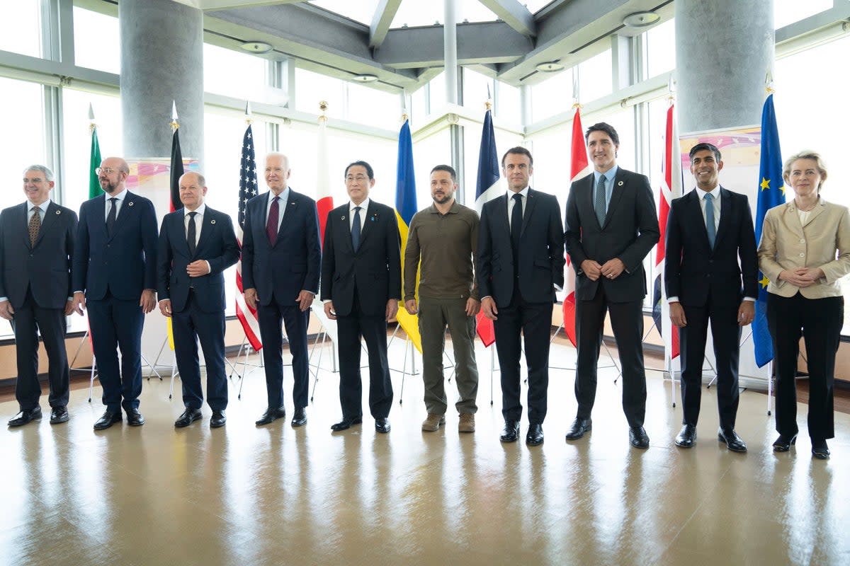 Ukrainian President Volodymyr Zelensky, center, poses with G7 world leaders on the final day of the G7 Summit in Hiroshima, Japan in May.From left to right are: Gianluigi Benedetti, Italian ambassador to Japan, European Council President Charles Michel, German Chancellor Olaf Scholz, U.S. President Joe Biden, Japan's Prime Minister Fumio Kishida, Zelenskyy, France's President Emmanuel Macron, Canada's Prime Minister Justin Trudeau, Britain's Prime Minister Rishi Sunak and European Commission President Ursula von der Leyen  (live)