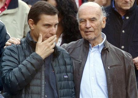 Convicted former Nazi SS captain Erich Priebke leaves with his lawyer Paolo Giachini (L) after attending a mass at a church in northern Rome in this October 17, 2010 file photo. REUTERS/Alessandro Bianchi/Files