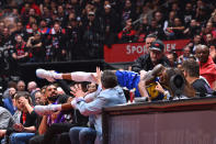 Andre Iguodala #9 of the Golden State Warriors dives into the stands against the Toronto Raptors during Game 1 of the NBA Finals on May 30, 2019 at Scotiabank Arena in Toronto. (Photo by Jesse D. Garrabrant/NBAE via Getty Images)