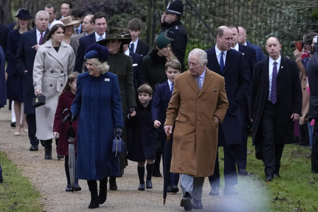 King Charles III, centre, and Camilla, the Queen Consort lead the Royal Family as they arrive to attend the Christmas day service at St Mary Magdalene Church in Sandringham in Norfolk, England, Sunday, Dec. 25, 2022. (AP Photo/Kirsty Wigglesworth)