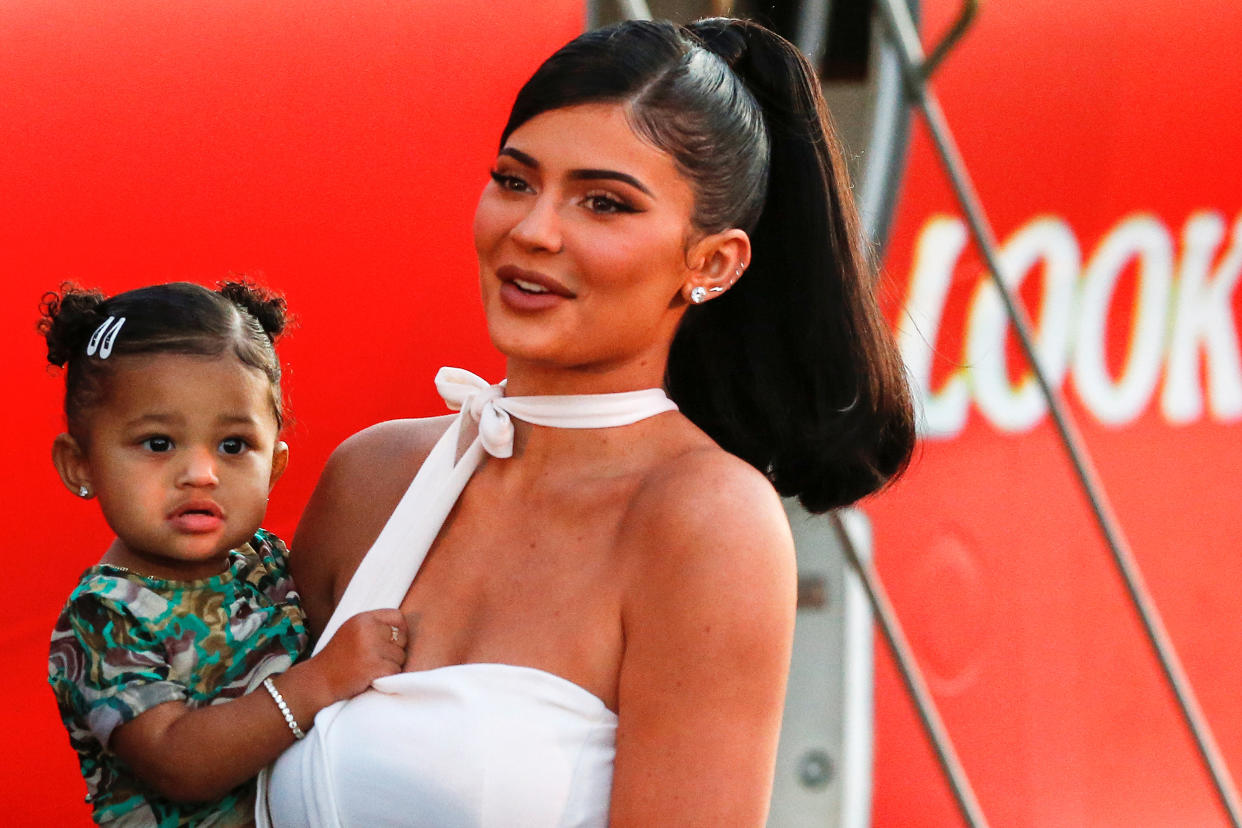 Kylie Jenner and her daughter Stormi Webster share a moment at the premiere for the documentary. (REUTERS)