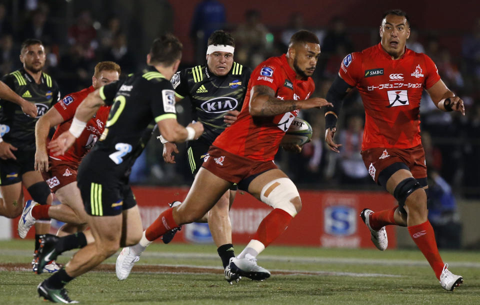 Sunwolves Rahboni Warren-Vosayaco, cenrter, runs at the Hurricanes defense during the Super Rugby game between the Hurricanes and Sunwolves in Tokyo, Friday, April 19, 2019. (AP Photo/Shuji Kajiyama)